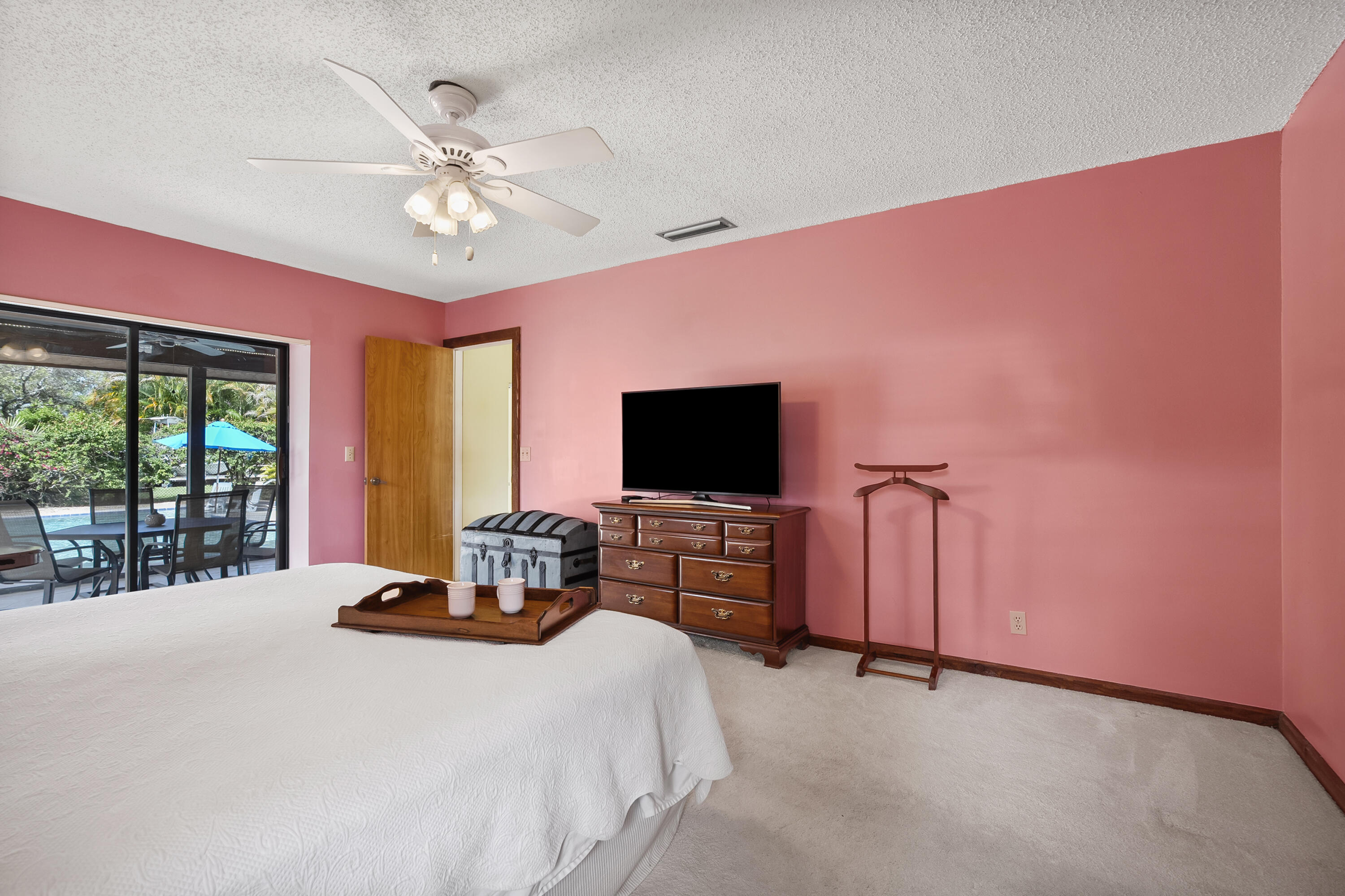 18815 South Golden Hawk Trail Jupiter, FL 33458 - Photo 29 of 49 a bedroom with a bed and a flat screen tv