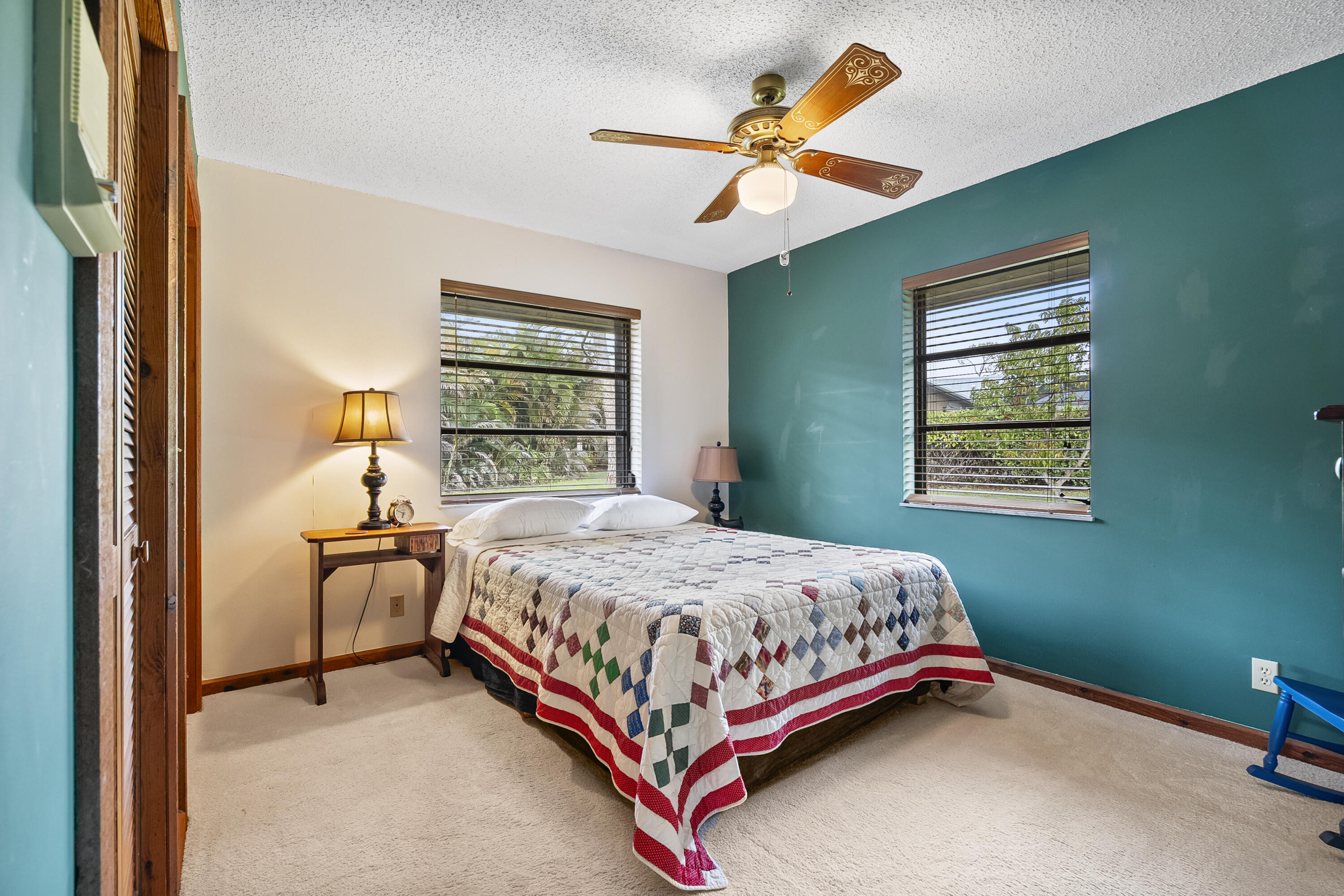 18815 South Golden Hawk Trail Jupiter, FL 33458 - Photo 33 of 49 a bedroom with a bed and window