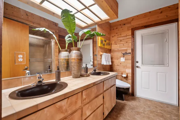 a bathroom with a glass shower door