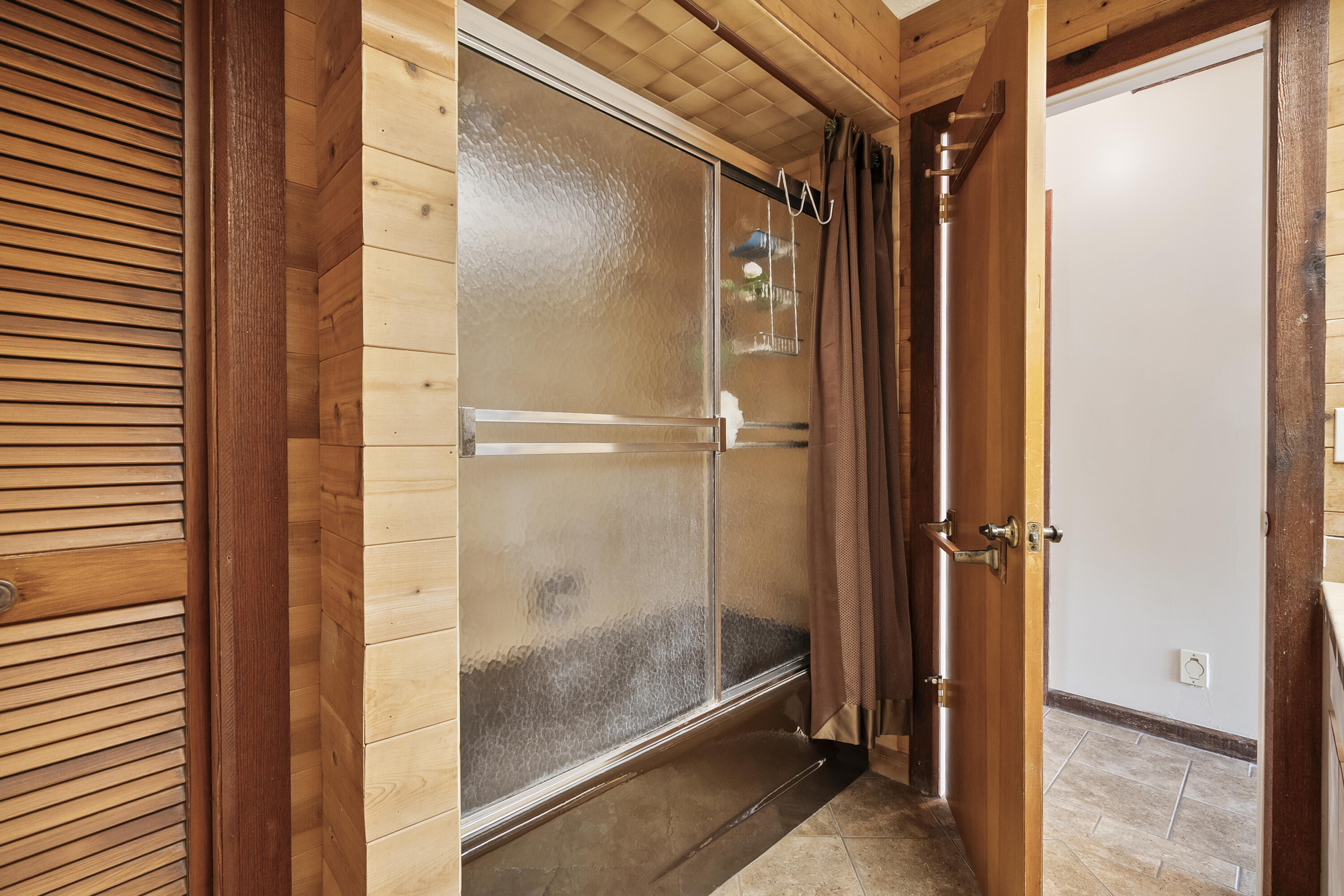 18815 South Golden Hawk Trail Jupiter, FL 33458 - Photo 35 of 49 a bathroom with a glass shower door