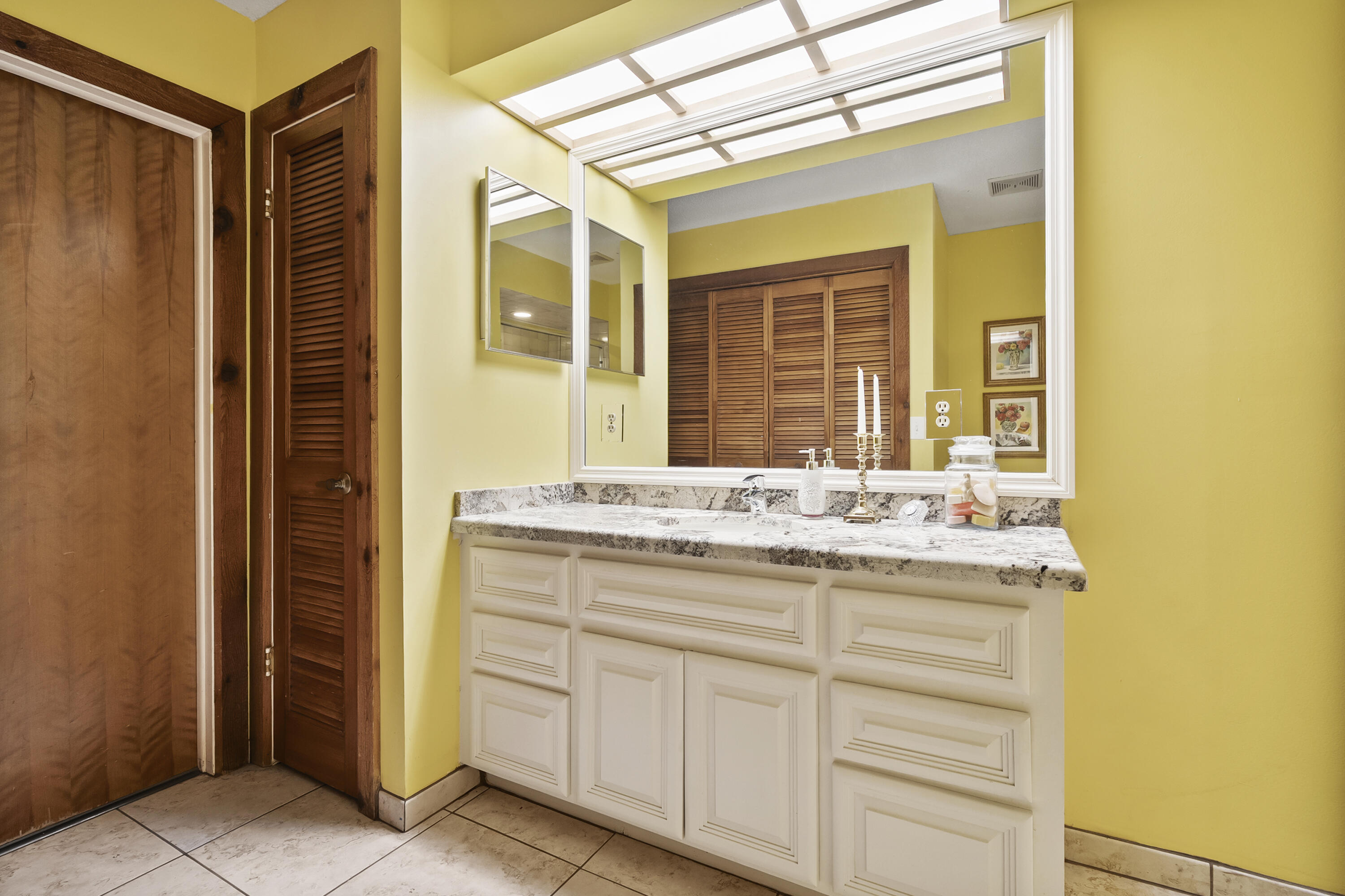 18815 South Golden Hawk Trail Jupiter, FL 33458 - Photo 38 of 49 a bathroom with a granite countertop sink and a mirror