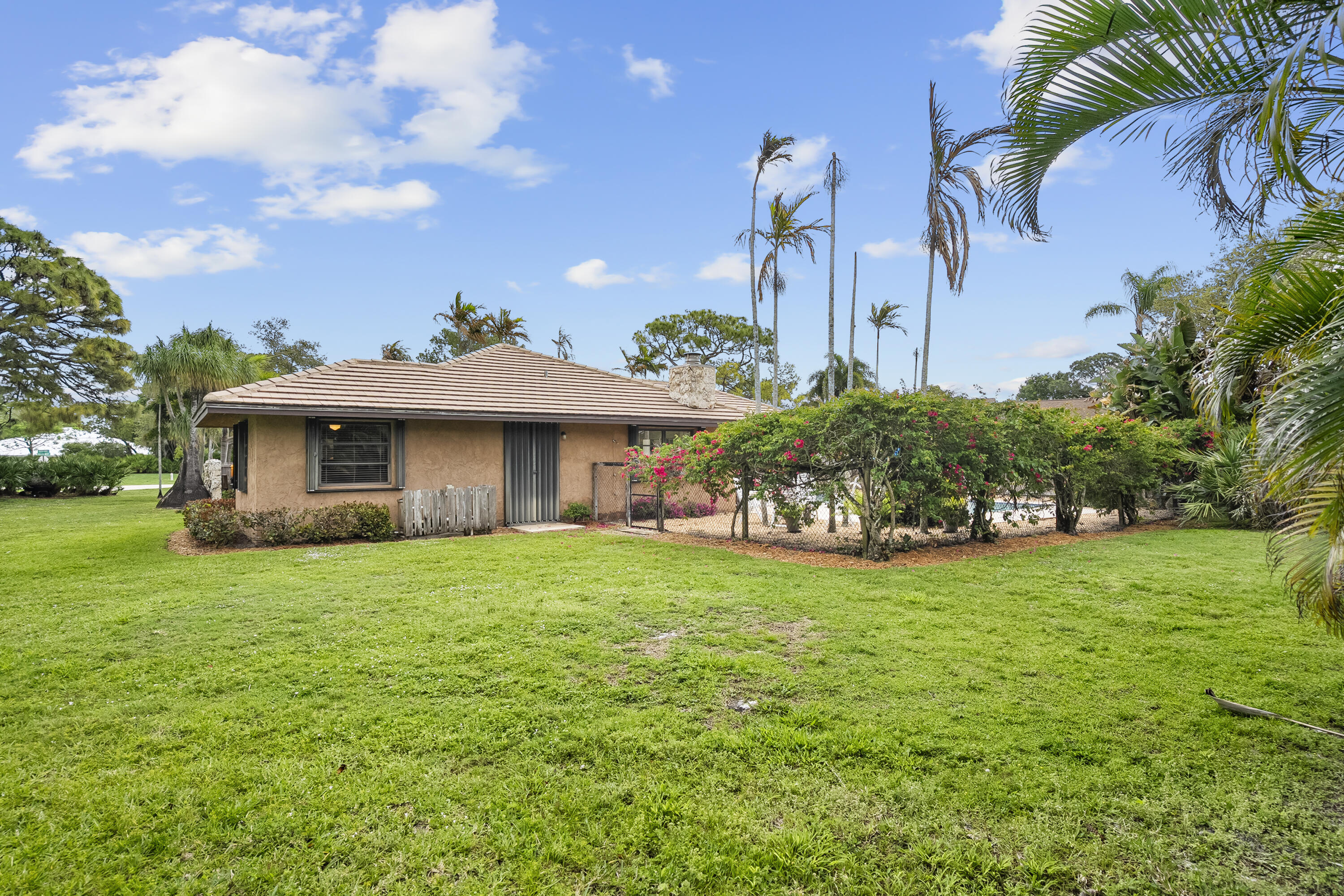 18815 South Golden Hawk Trail Jupiter, FL 33458 - Photo 42 of 49 a view of a house with a backyard