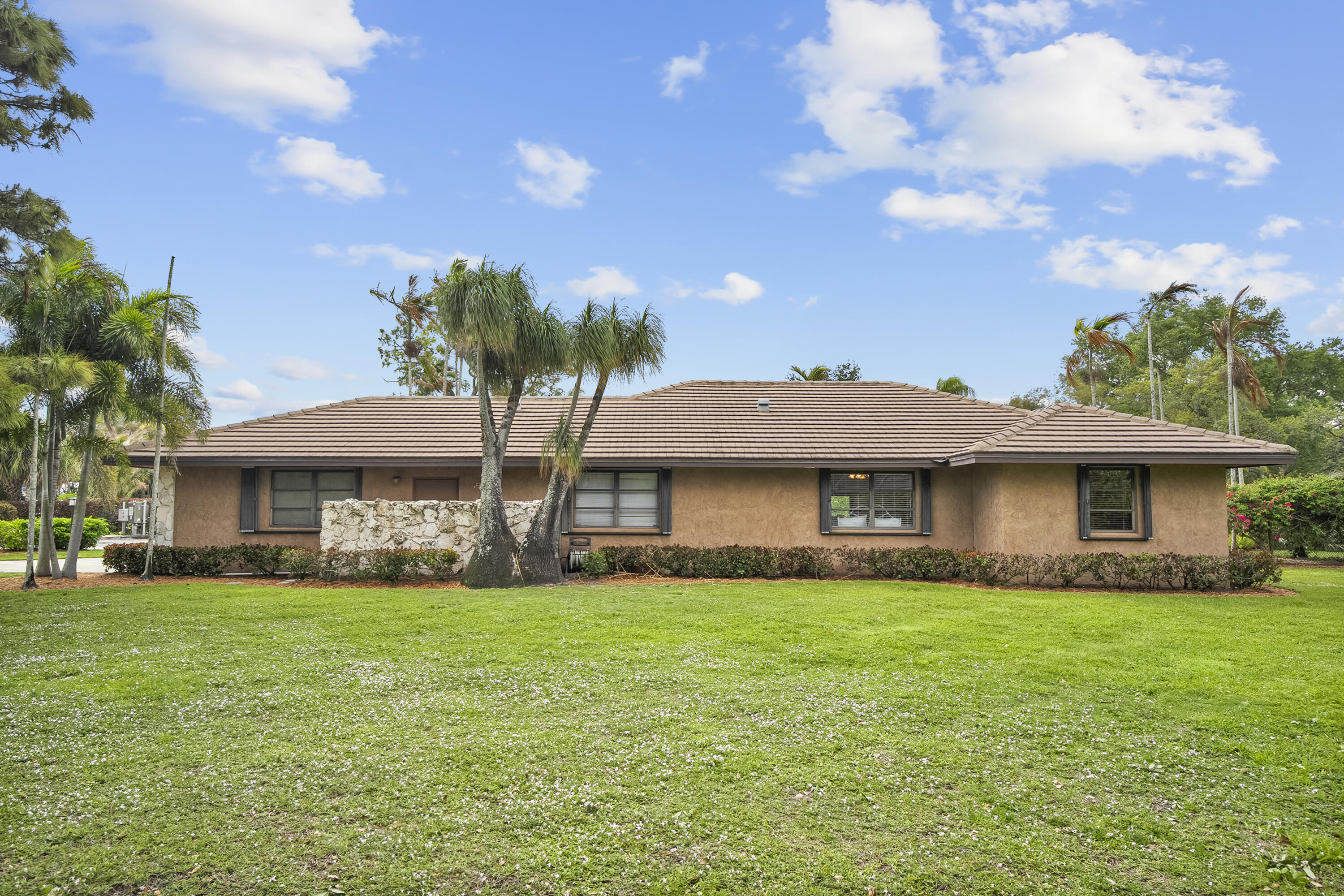 18815 South Golden Hawk Trail Jupiter, FL 33458 - Photo 43 of 49 a view of a house with a garden