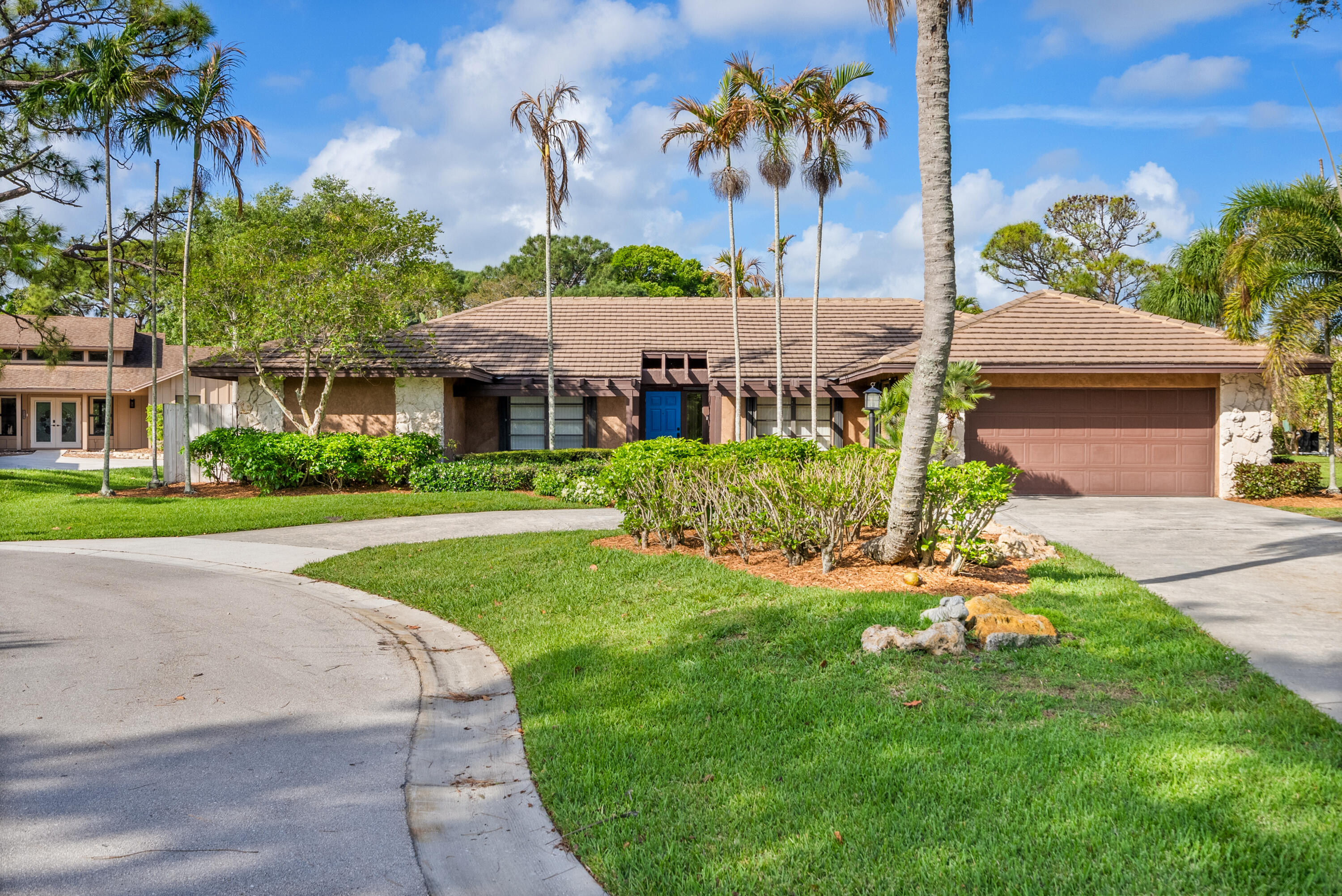 18815 South Golden Hawk Trail Jupiter, FL 33458 - Photo 44 of 49 a front view of a house with a yard