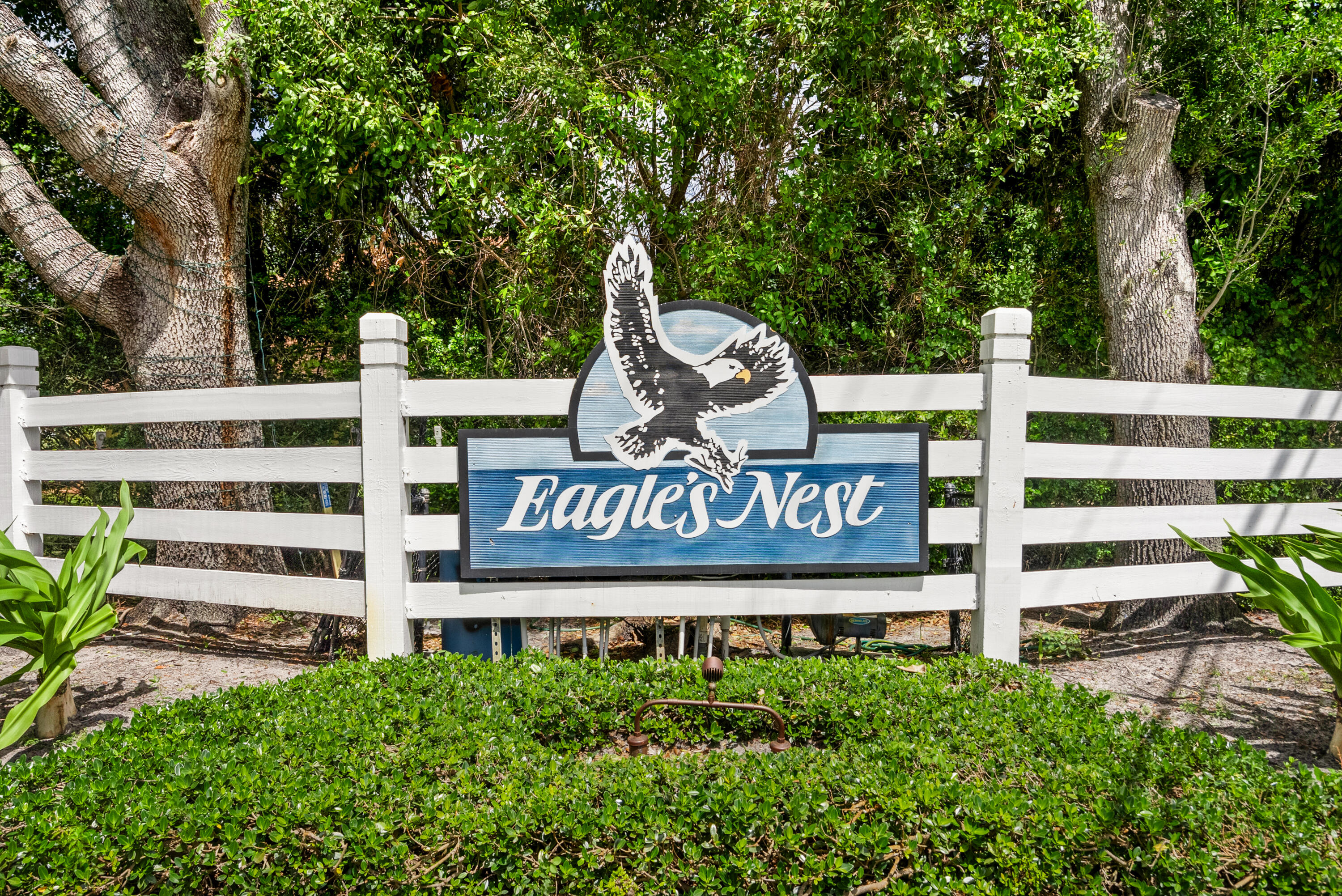 18815 South Golden Hawk Trail Jupiter, FL 33458 - Photo 45 of 49 a view of sign board with yard and trees