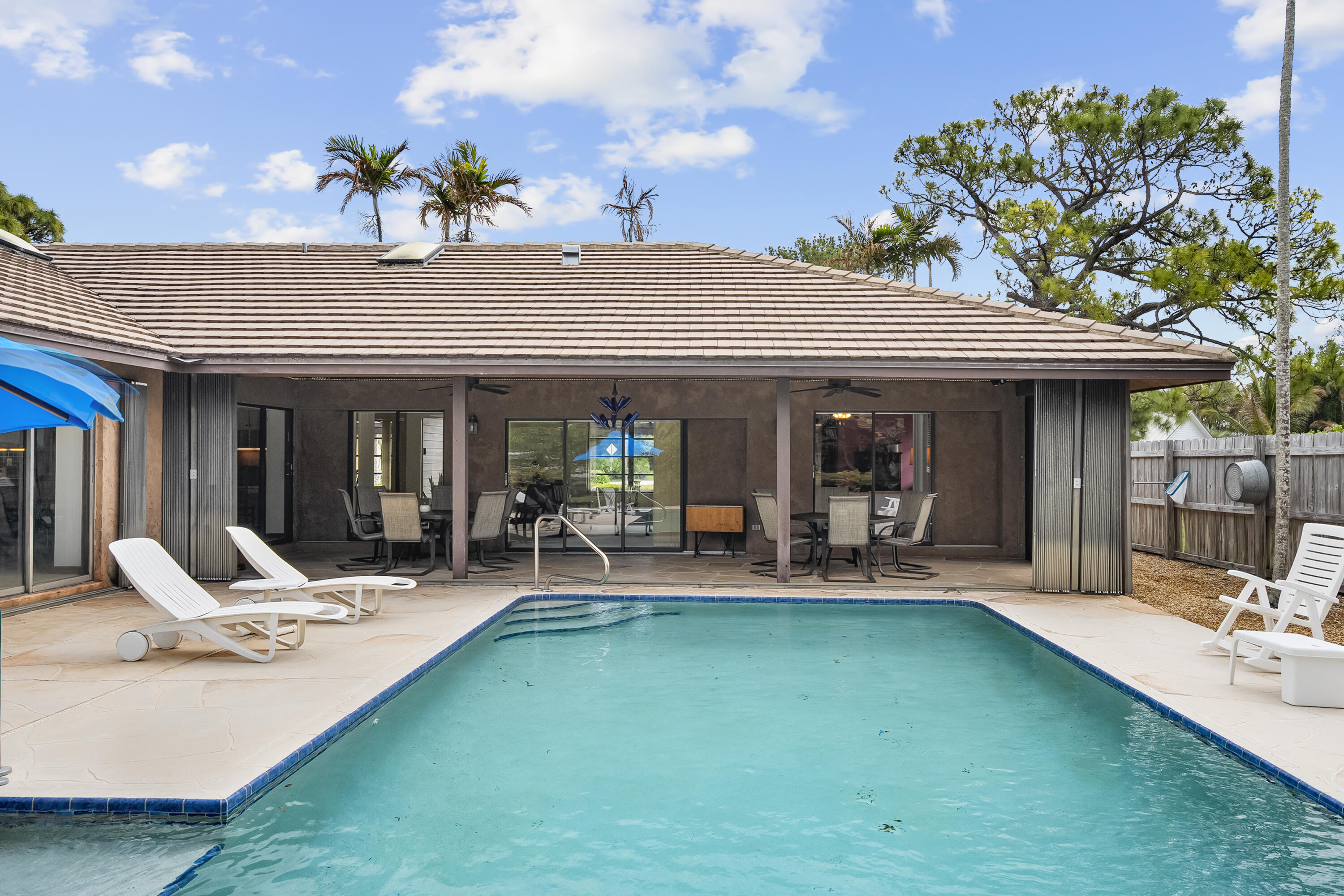 18815 South Golden Hawk Trail Jupiter, FL 33458 - Photo 5 of 49 a view of a house with swimming pool and sitting area