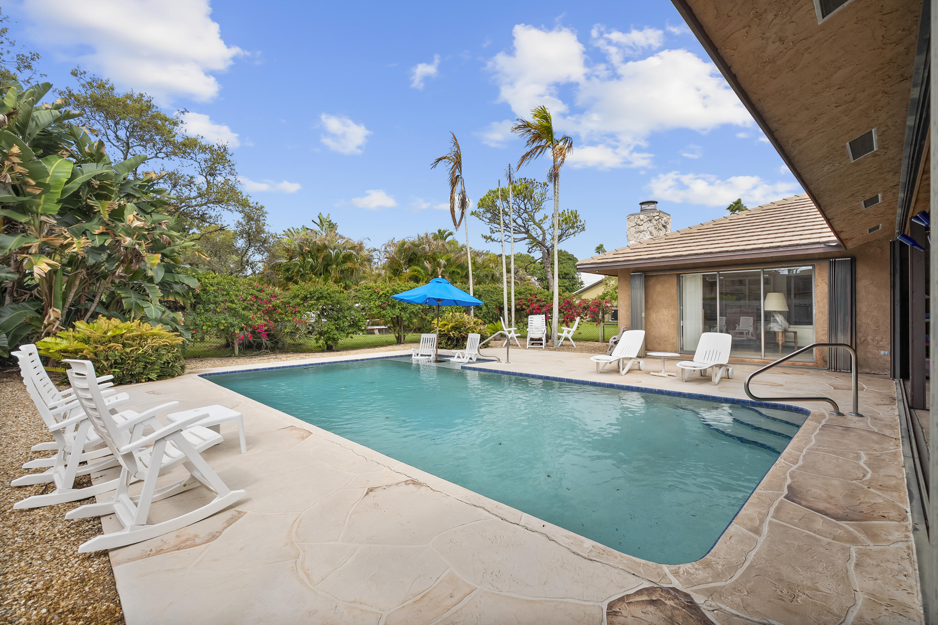 18815 South Golden Hawk Trail Jupiter, FL 33458 - Photo 7 of 49 swimming pool view with a garden space