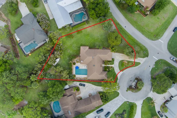 an aerial view of a house with outdoor space