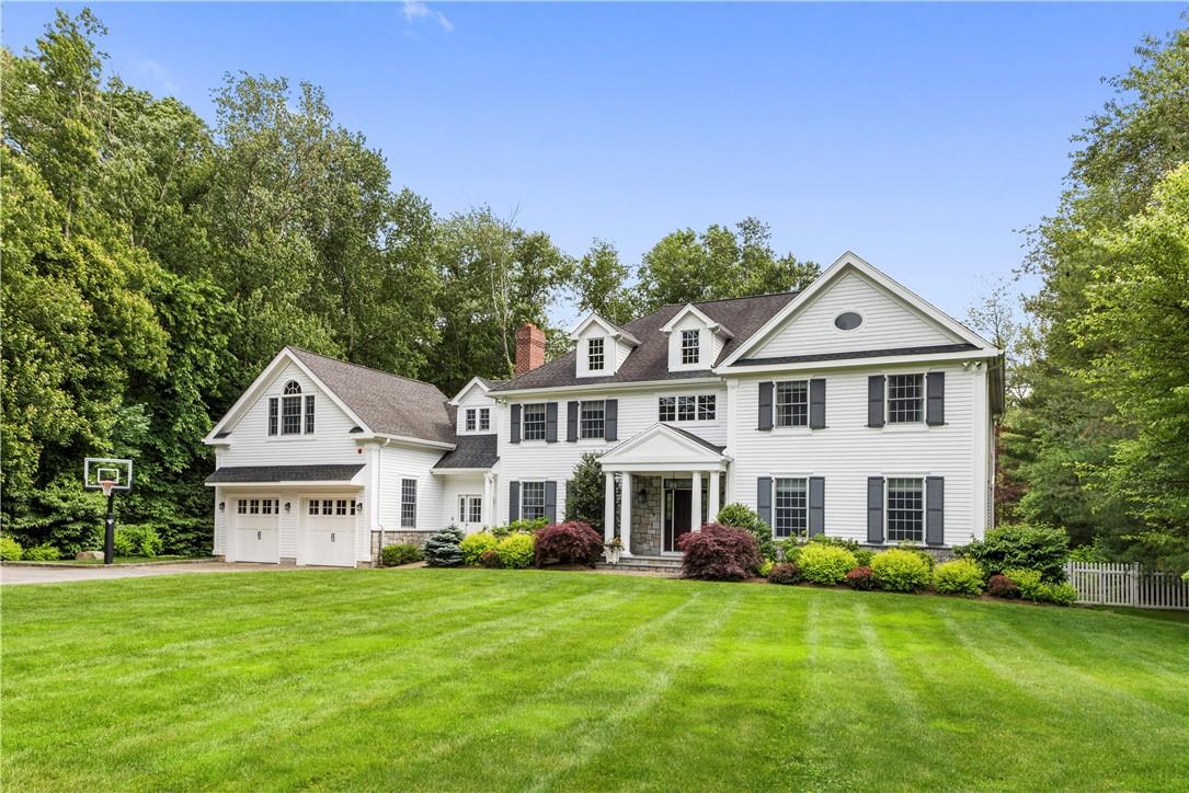 Welcome to 12 Woodmill Road, Chappaqua, a bright, young, super-spacious Colonial that lives like a 5-bedroom home, with a flat 1.45-acre parcel featuring a beautiful in-ground pool, set on a quiet dead-end street & bordering a 92-acre nature preserve.