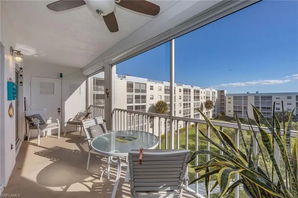 a view of a balcony with chairs