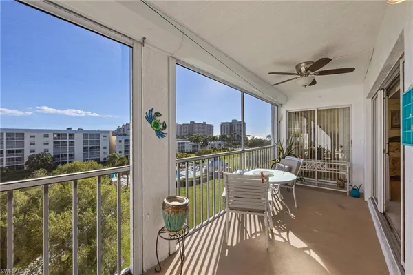 a view of a balcony and chairs