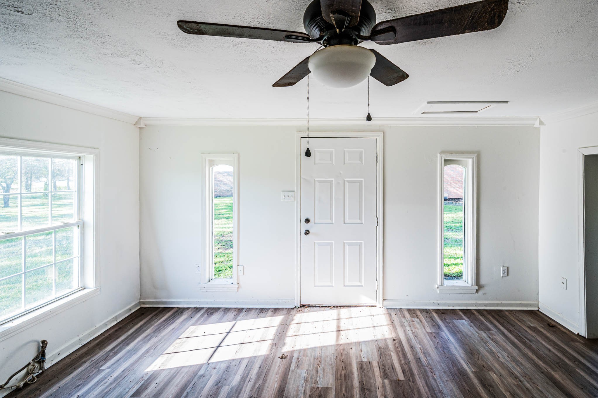 1800 Plano Road Bowling Green, KY 42104 - Photo 36 of 47 an empty room with windows ceiling fan and hardwood floor
