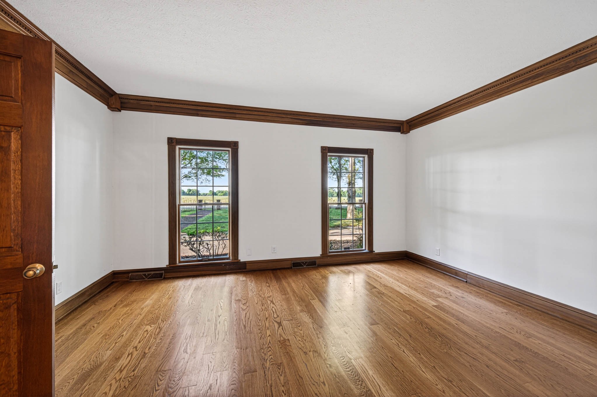 1800 Plano Road Bowling Green, KY 42104 - Photo 8 of 47 a view of an empty room with wooden floor and a window