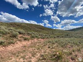 800 Homestead Road Road Cokeville, WY 83114 - Photo 2 of 49 Expansive land parcel featuring natural terrain, varied vegetation, and clear skies