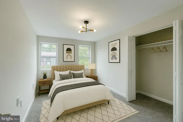 a bedroom with a large bed and a window