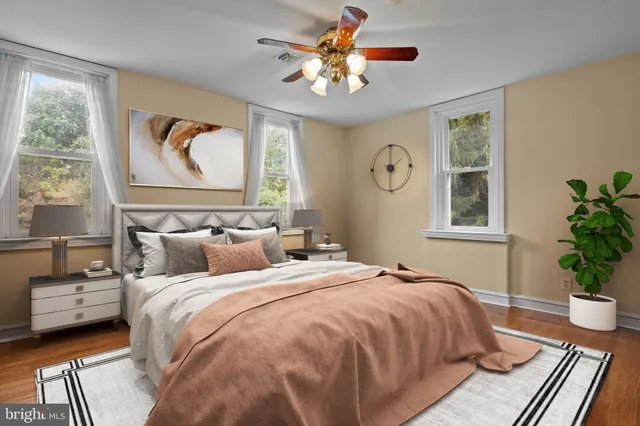 a bedroom with a large bed and a window