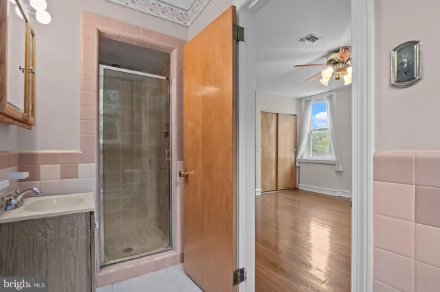 a bathroom with a shower and a sink