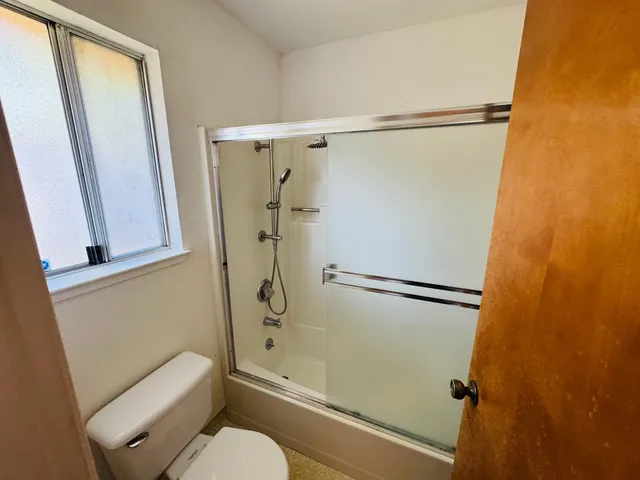 a bathroom with a double vanity sink mirror double vanity and toilet