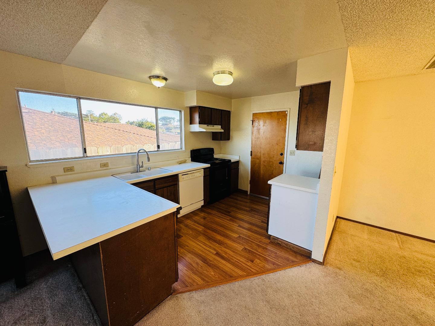 3003 Crescent Street Marina, CA 93933 - Photo 5 of 20 a kitchen with a sink appliances and cabinets