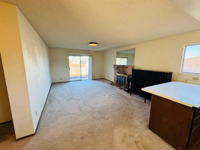 a view of room with furniture and a window