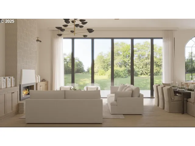 a living room with furniture and large windows