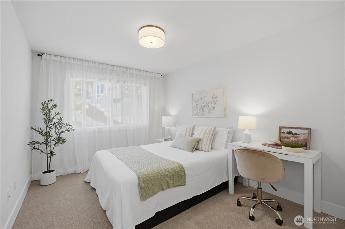20580 Sinnes Road Mount Vernon, WA 98274 - Photo 27 of 39 a bedroom with a bed and a potted plant