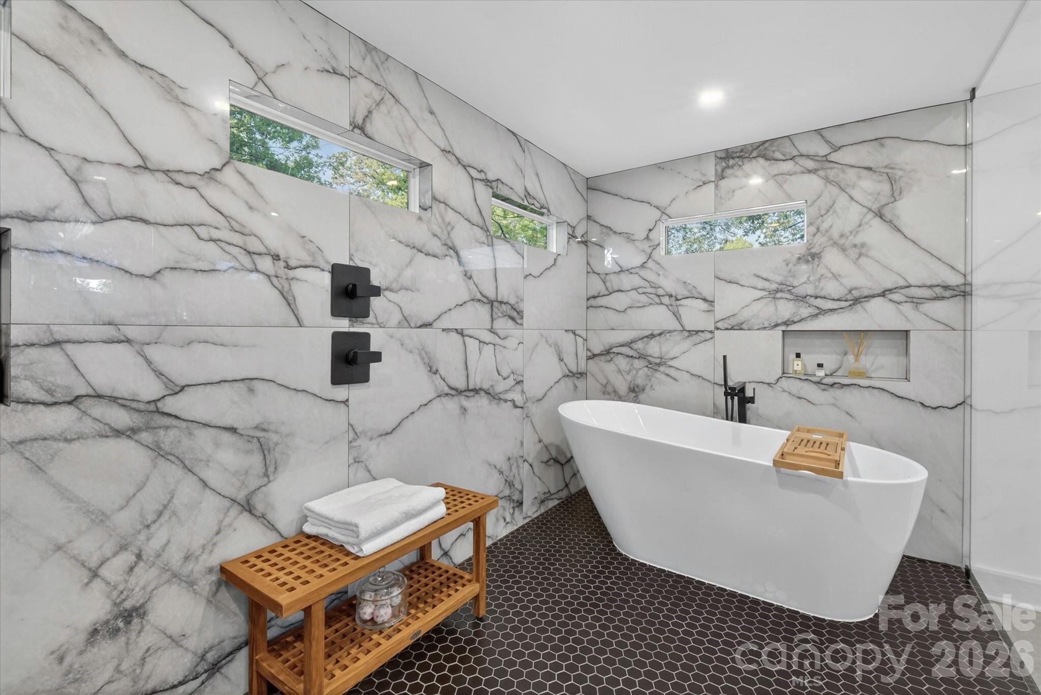 1608 Chippendale Road Charlotte, NC 28205 - Photo 38 of 46 a white bath tub sitting in a bathroom
