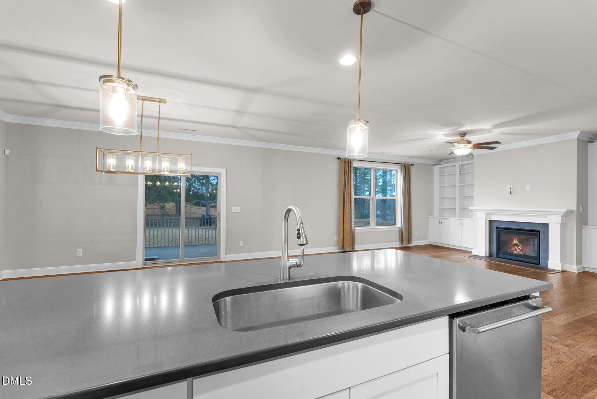928 Barringer Drive Raleigh, NC 27606 - Photo 8 of 40 a kitchen with a sink and chandelier