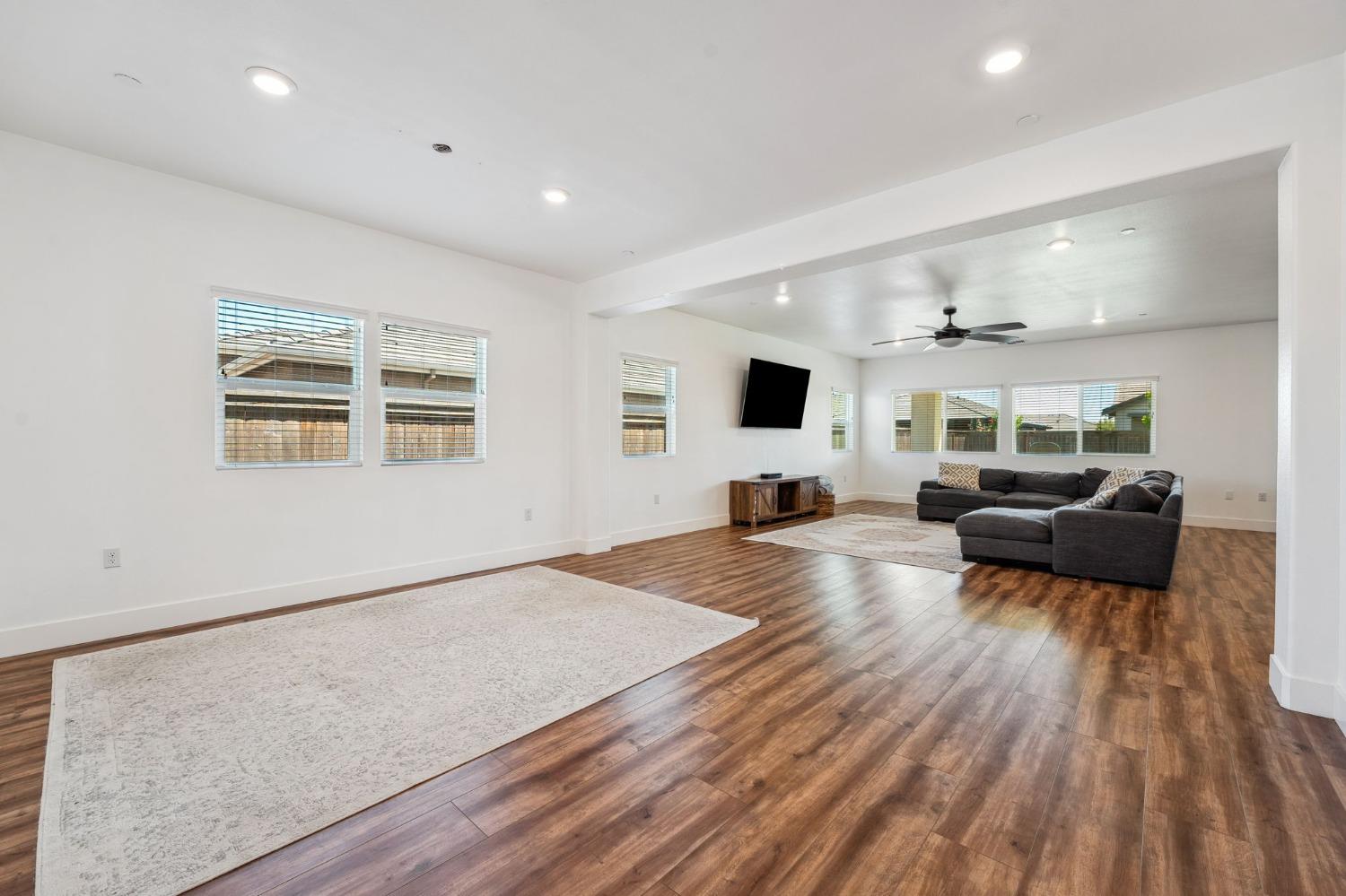 2074 Abbeylane Way Olivehurst, CA 95961 - Photo 11 of 39 a living room with furniture and a flat screen tv
