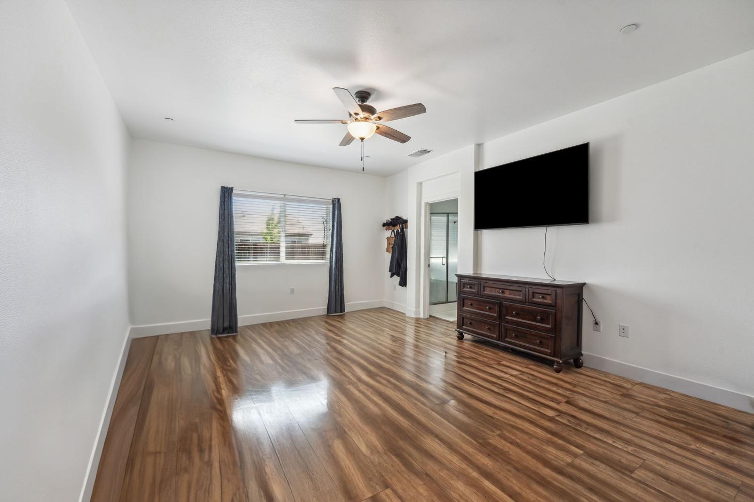 2074 Abbeylane Way Olivehurst, CA 95961 - Photo 13 of 39 a living room with furniture and a flat screen tv