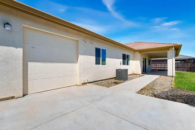 a front view of a house with garage