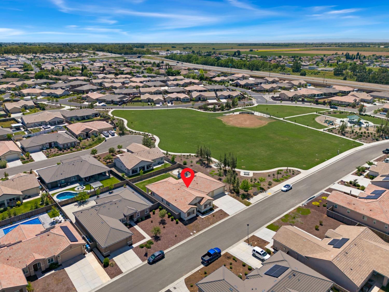 2074 Abbeylane Way Olivehurst, CA 95961 - Photo 30 of 39 an aerial view of a city with lots of residential buildings and ocean view in back