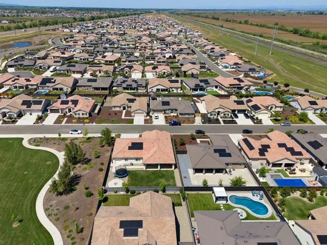 an aerial view of a city with lots of residential buildings