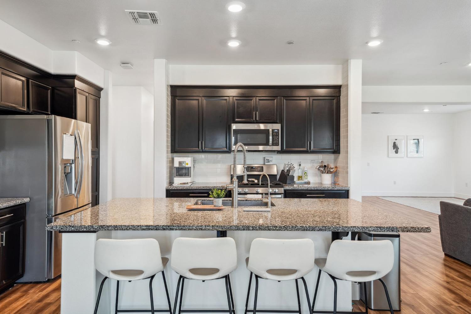 2074 Abbeylane Way Olivehurst, CA 95961 - Photo 8 of 39 a kitchen with granite countertop a sink and counter space
