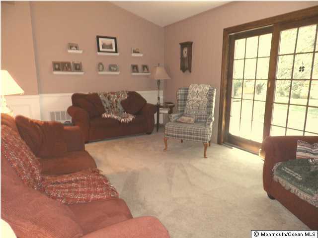 26 Turnberry Drive Lincroft, NJ 07738 - Photo 11 of 16 a living room with furniture and large windows
