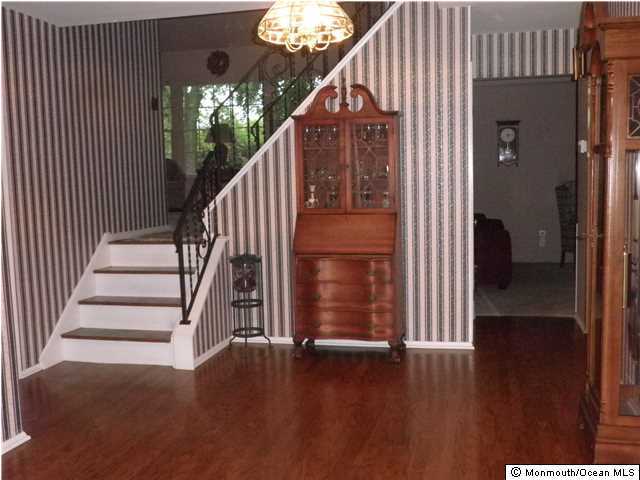 26 Turnberry Drive Lincroft, NJ 07738 - Photo 2 of 16 a view of entryway with wooden floor