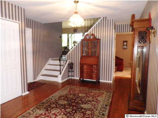 26 Turnberry Drive Lincroft, NJ 07738 - Photo 3 of 16 a view of entryway with wooden floor