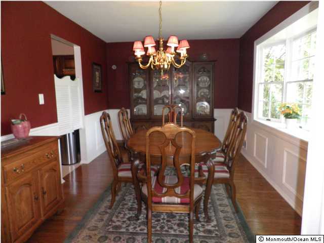 26 Turnberry Drive Lincroft, NJ 07738 - Photo 4 of 16 a view of a dining room with furniture a chandelier and wooden floor