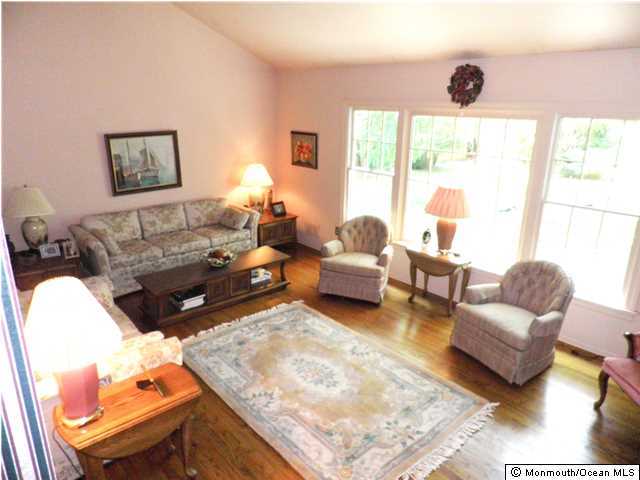 26 Turnberry Drive Lincroft, NJ 07738 - Photo 7 of 16 a living room with furniture and a large window