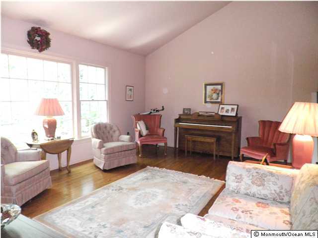 26 Turnberry Drive Lincroft, NJ 07738 - Photo 8 of 16 a living room with furniture and a large window