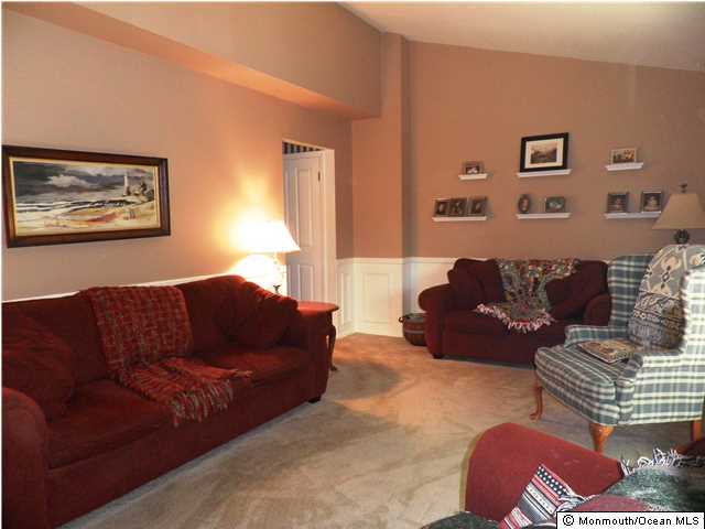 26 Turnberry Drive Lincroft, NJ 07738 - Photo 9 of 16 a living room with furniture and a couch