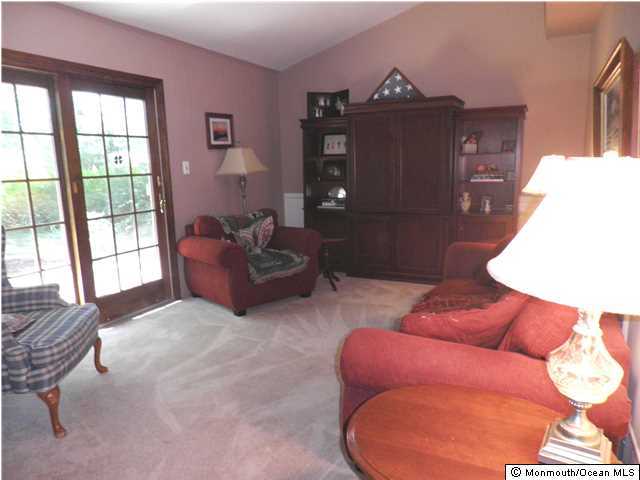 26 Turnberry Drive Lincroft, NJ 07738 - Photo 10 of 16 a living room with furniture and a window