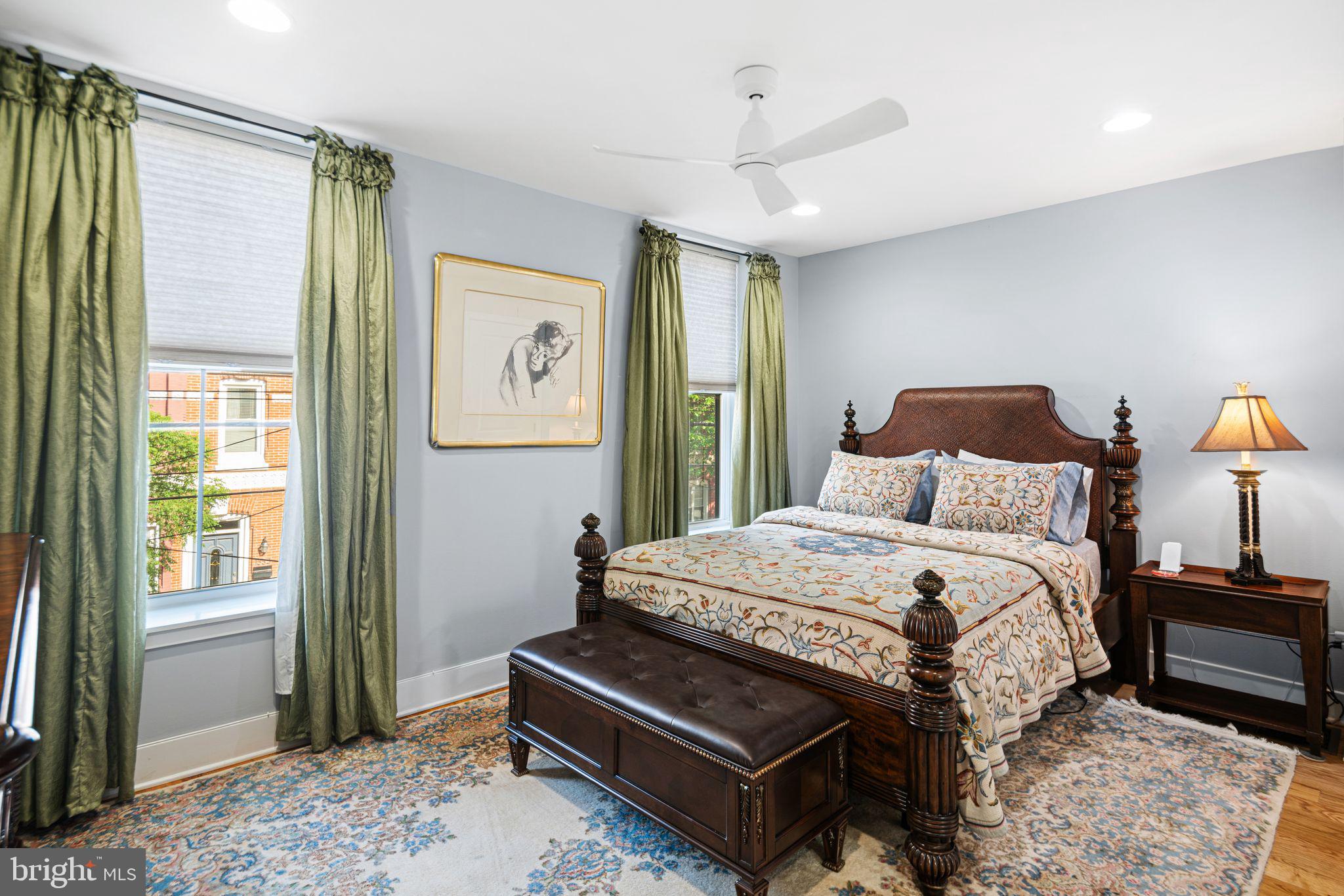 1330 South 16th Street Philadelphia, PA 19146 - Photo 12 of 37 a bedroom with a bed lamp and a window