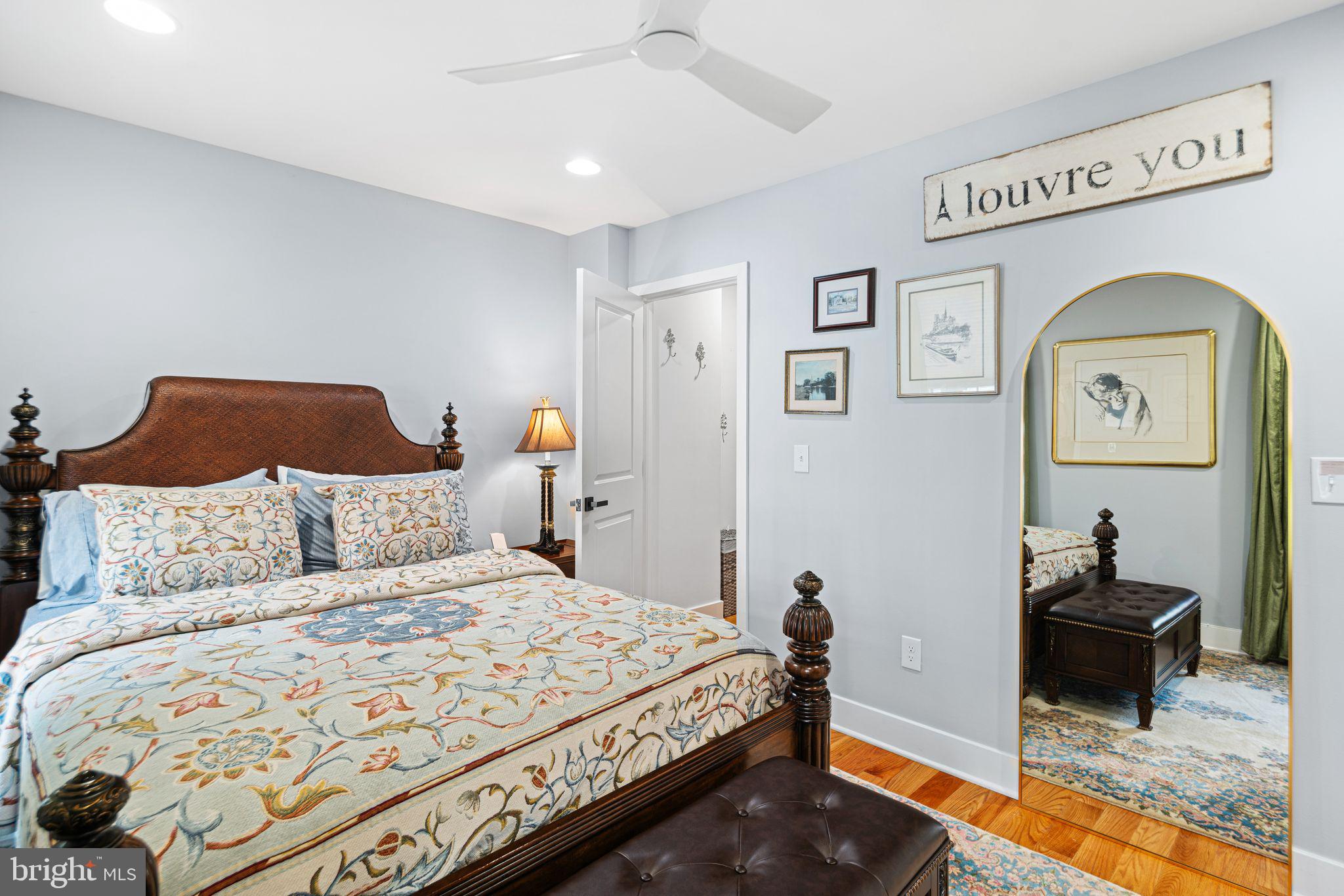 1330 South 16th Street Philadelphia, PA 19146 - Photo 13 of 37 a bedroom with a bed and a chandelier