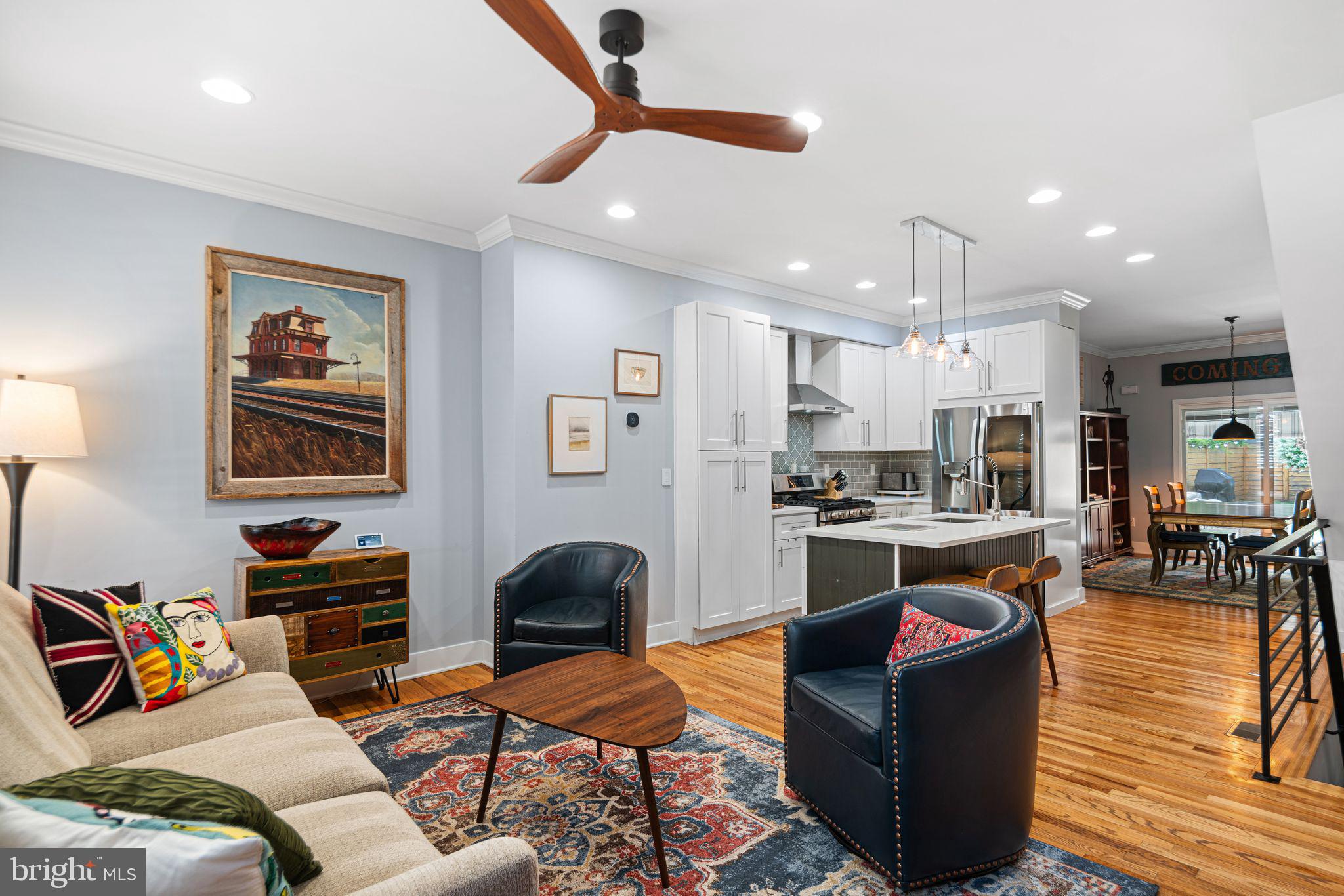 1330 South 16th Street Philadelphia, PA 19146 - Photo 2 of 37 a living room with furniture kitchen view and a wooden floor