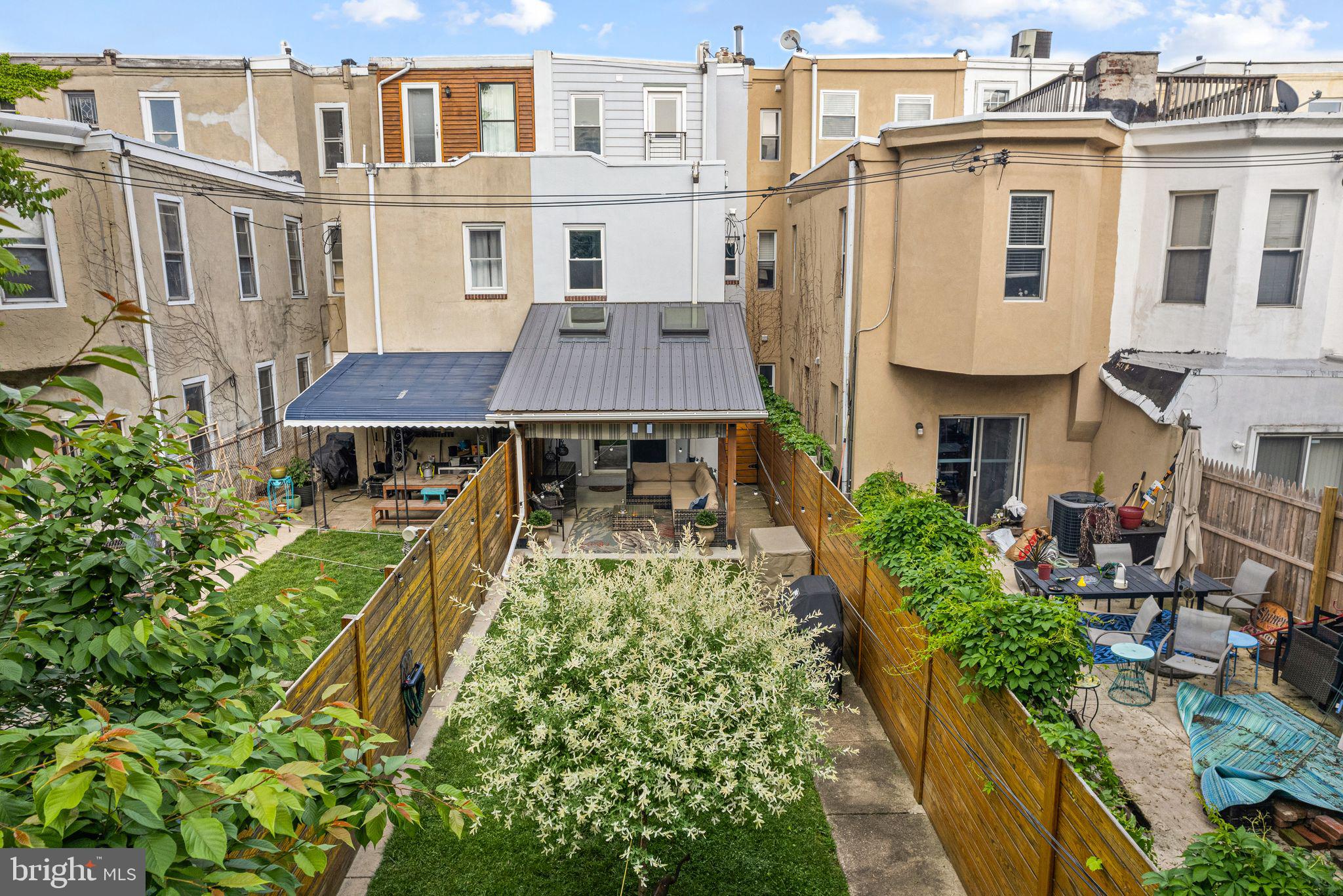 1330 South 16th Street Philadelphia, PA 19146 - Photo 29 of 37 a aerial view of a house with a yard and potted plants