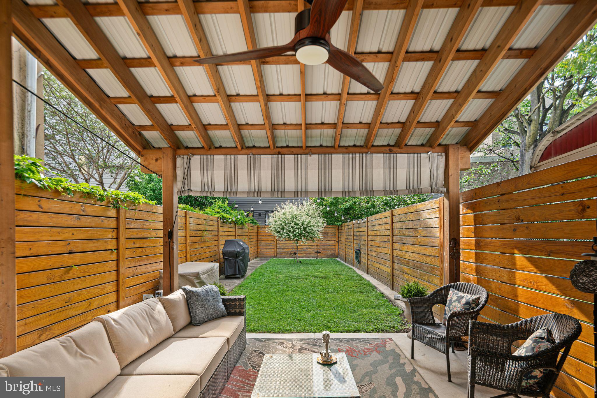 1330 South 16th Street Philadelphia, PA 19146 - Photo 8 of 37 a view of a patio with a table and chairs and a barbeque
