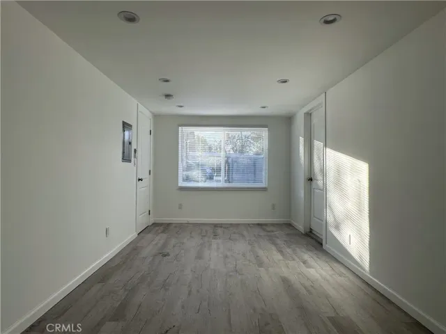 a bathroom with a toilet a sink a mirror and a bathtub