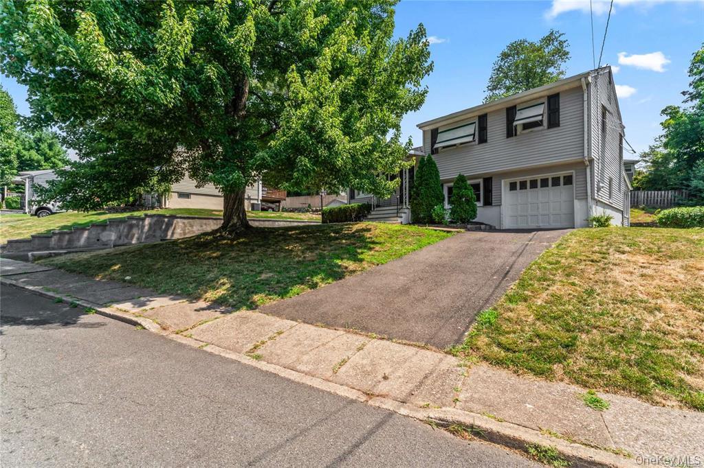 6 Valley View Terrace Suffern, NY 10901 - Photo 1 of 19 a front view of a house with a garden and trees