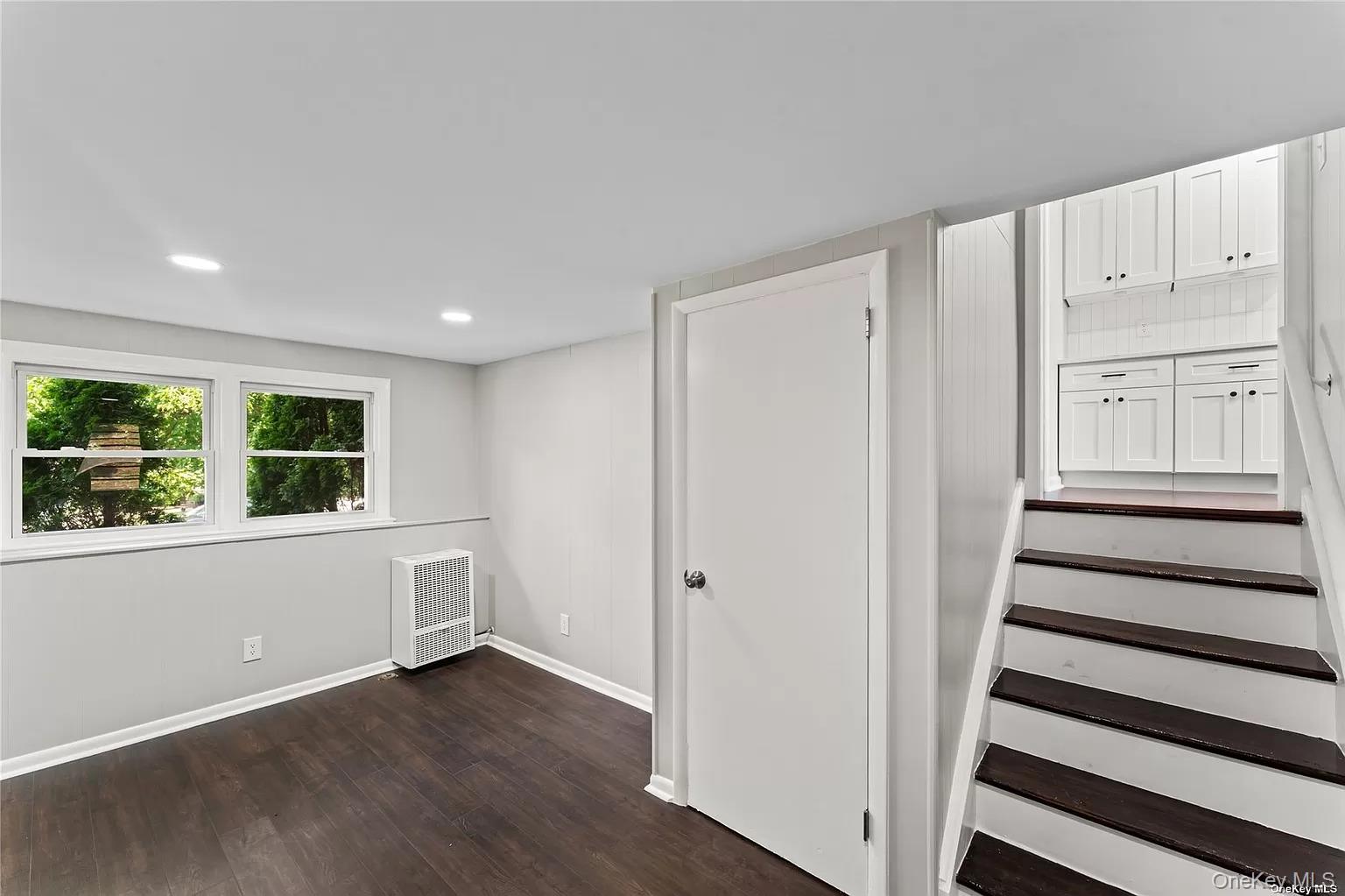 6 Valley View Terrace Suffern, NY 10901 - Photo 15 of 19 an empty room with wooden floor and windows
